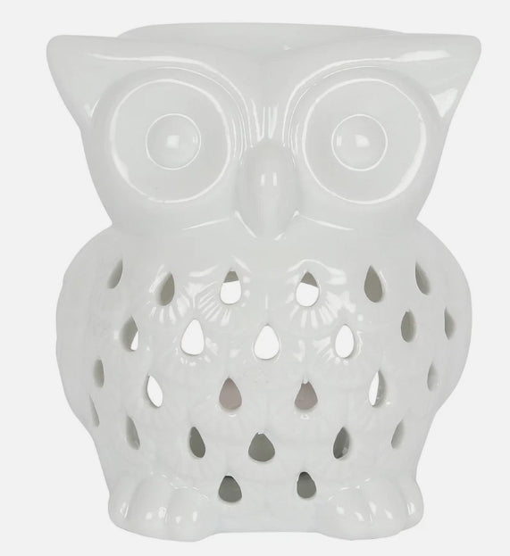 A white ceramic owl-shaped wax burner with cutout details on the front, shown against a plain background.
