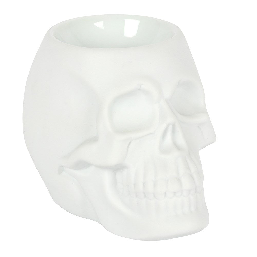 White skull-shaped wax burner on a white background